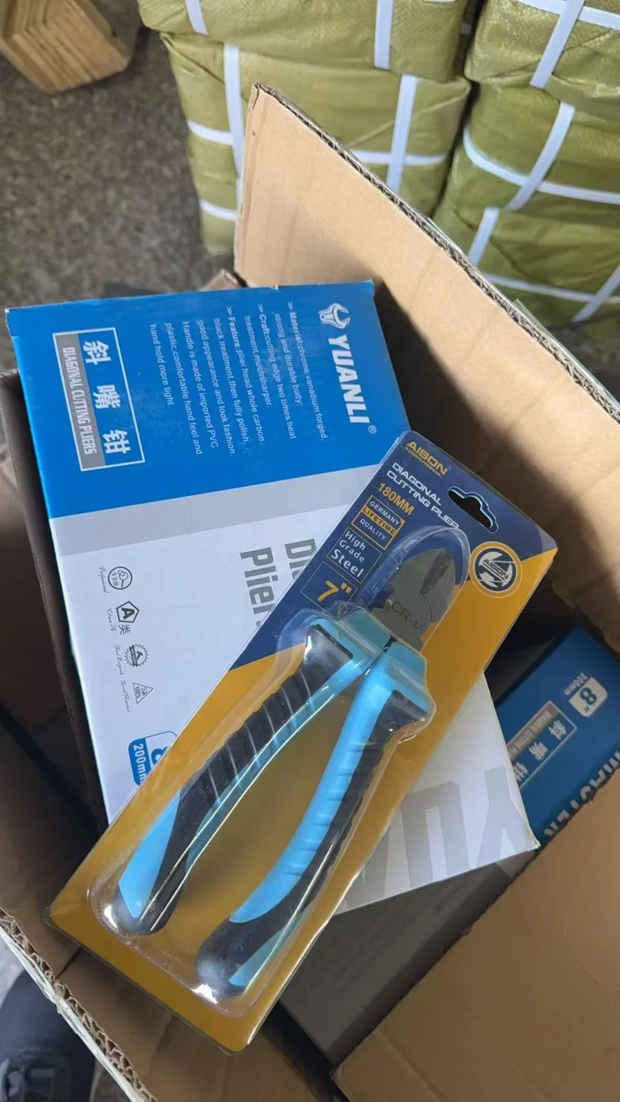 Packaged diagonal cutting pliers shown with dual-colour grips.